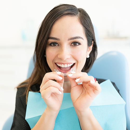 patient holding a clear tray